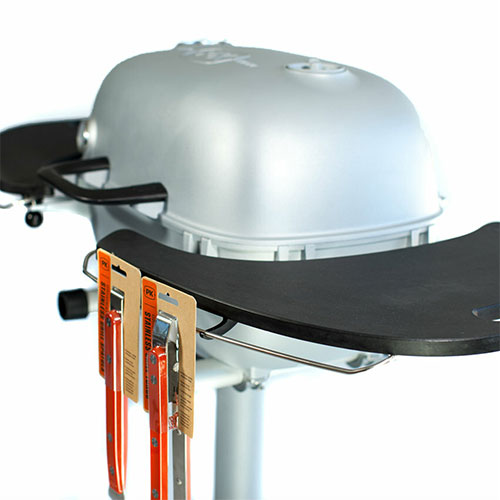 Firesmiths PK Series charcoal grill with durable side shelf featuring an integrated magnetic knife holder for safe, convenient access to barbecue tools while cooking.