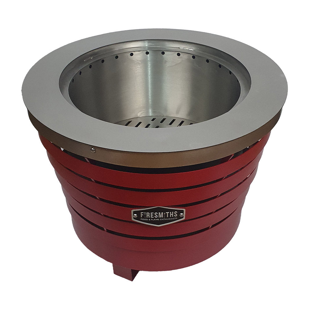 Firesmiths smokeless fire pit in a bold red finish, featuring durable steel construction, a double-wall airflow system, and efficient low-smoke performance for outdoor entertaining and fires.
