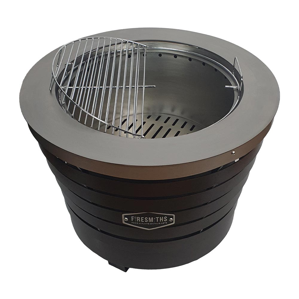 Firesmiths Smokeless Fire Pit featuring a removable stainless steel grill grate, allowing you to switch effortlessly between clean-burning outdoor fires and open-fire grilling for versatile outdoor cooking.