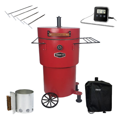 A red vertical charcoal smoker and grill with two side shelves and wheels for mobility. 