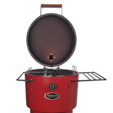 A red vertical charcoal smoker and grill with two side shelves and wheels for mobility. 