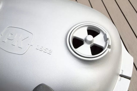 Close-up of the adjustable air vent on the lid of a Firesmiths cast iron charcoal braai, designed to precisely control airflow and cooking temperature for grilling and smoking.