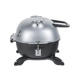 Compact Firesmiths cast iron charcoal braai with a silver domed lid, adjustable air vents, locking lid latch, sturdy carry handles, and a durable pedestal base for portable outdoor grilling and smoking.