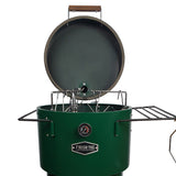 Close-up of the Firesmiths Hero Smoker & Grill in a forest green finish with the lid open, showcasing the stainless steel hanging rack system, meat hooks, dual side shelves, and built-in temperature gauge for versatile smoking.