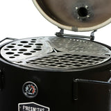 Close-up of the Firesmiths Hero Smoker with the lid open, showcasing the multi-level stainless steel cooking grate system with interchangeable grill, searing, and accessory plates for versatile wood-fired cooking.