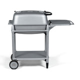 Side profile of the Firesmiths PK360 Silver charcoal grill featuring a cast aluminum body, heavy-duty rolling cart, integrated side shelf, lower storage shelf, and precision airflow controls for premium outdoor grilling and smoking.