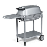Firesmiths PK360 Silver charcoal grill with a heavy-duty rolling cart, folding side shelf, lower storage shelf, cast aluminum body, and precision airflow controls for professional outdoor grilling and smoking.