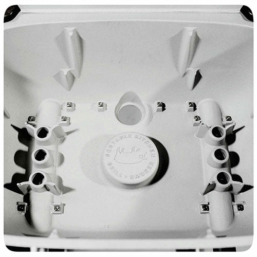 Close-up of the cast aluminum interior of the Firesmiths PK Series charcoal grill, showcasing its durable construction, integrated vent system, and precision-engineered design for superior heat retention and airflow.