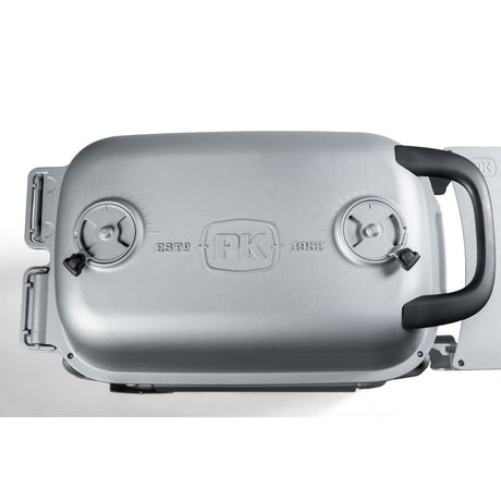 Top view of the Firesmiths PK Series cast aluminum charcoal grill lid featuring dual precision air vents, an ergonomic heat-resistant handle, and the embossed PK logo for exceptional airflow and temperature control.
