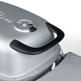 Close-up of the Firesmiths PK Series cast aluminum charcoal grill featuring the ergonomic heat-resistant lid handle and precision adjustable air vent for comfortable, controlled grilling and smoking.