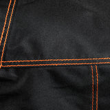 Close-up of the durable black fabric and reinforced orange stitching on the Firesmiths PK Series premium grill cover, showcasing high-quality craftsmanship and weather-resistant construction.