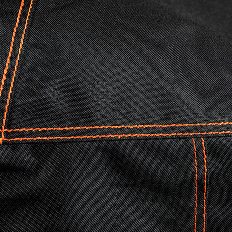 Close-up of the durable black fabric and reinforced orange stitching on the Firesmiths PK Series premium grill cover, showcasing high-quality craftsmanship and weather-resistant construction.
