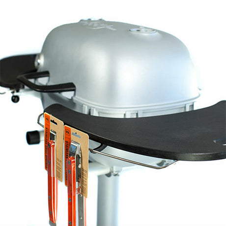 Firesmiths PK Series charcoal grill with durable side shelf featuring an integrated magnetic knife holder for safe, convenient access to barbecue tools while cooking.