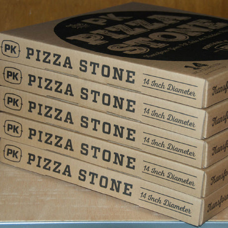 Stack of Firesmiths 14-inch premium pizza stone boxes, designed for baking crispy wood-fired pizzas, artisan breads, and other high-heat barbecue favourites on charcoal grills and smokers.