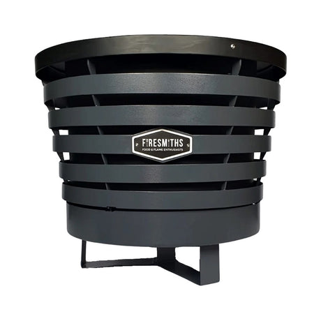 Firesmiths smokeless fire pit in a charcoal black finish, featuring durable steel construction, a double-wall airflow system, and clean-burning low-smoke performance for outdoor entertaining and fire gatherings.