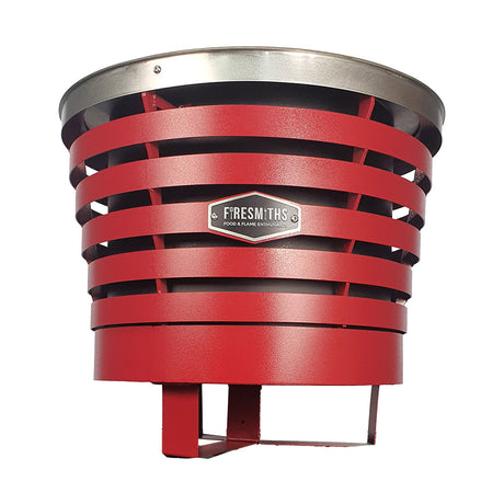 Firesmiths smokeless fire pit in a bold red finish, featuring durable steel construction, a double-wall airflow system, and efficient low-smoke performance for outdoor entertaining and fires.