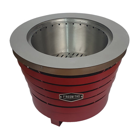 Firesmiths smokeless fire pit in a bold red finish, featuring durable steel construction, a double-wall airflow system, and efficient low-smoke performance for outdoor entertaining and fires.
